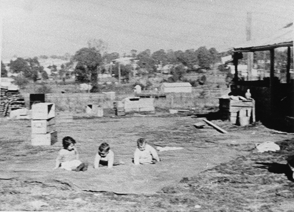 Unknown Children sitting on a blanket