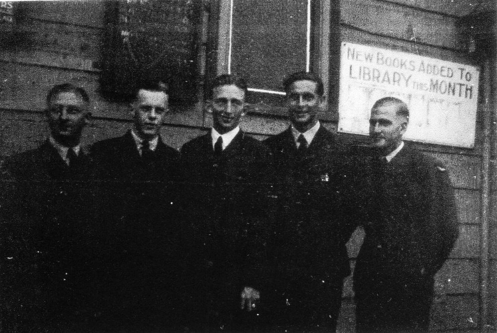 Group of men in front of Blacktown School of Arts building
