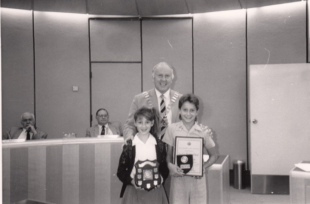 Mayor Leo Kelly with children receiving an award