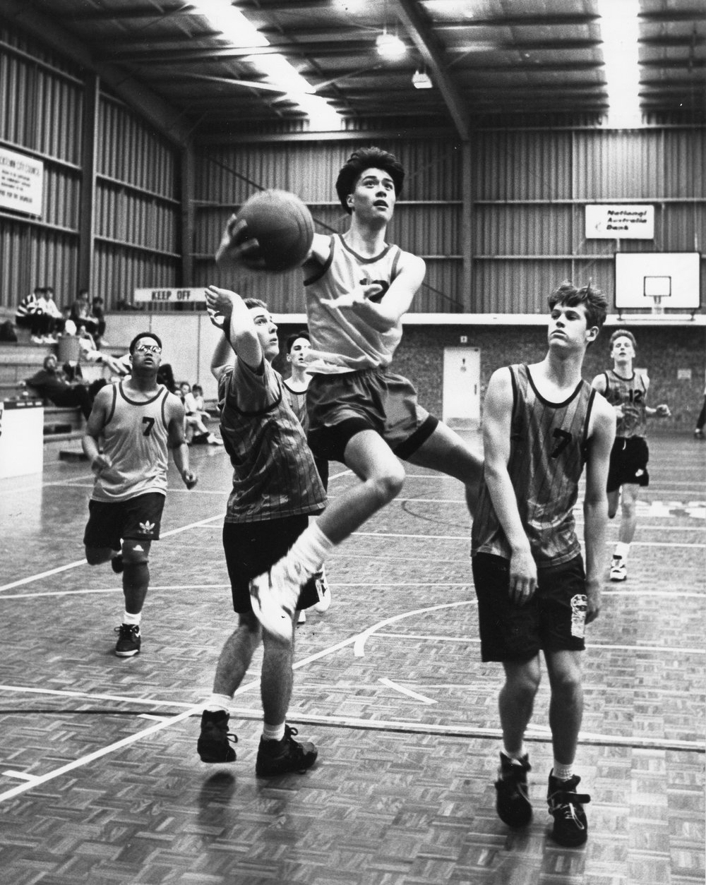 John Paul II Basketball Team in action