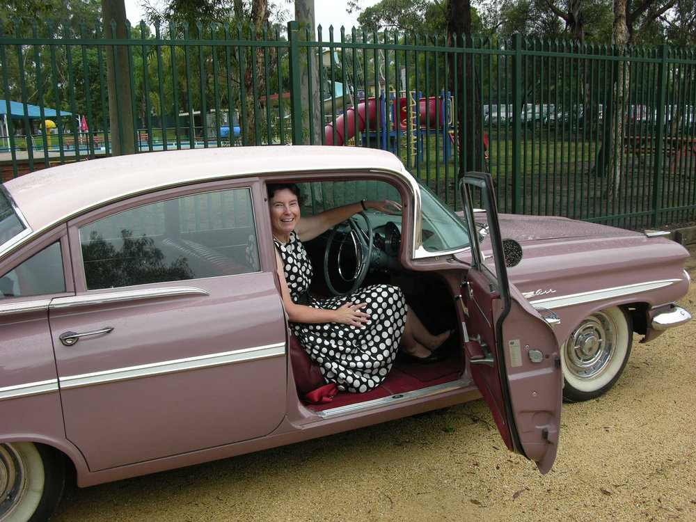 Rosemary Phillis in a vintage car