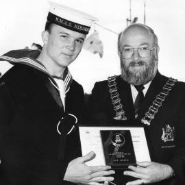 Mayor Robert Sinclair presents award to HMAS Nirimba cadet J. Hamlin