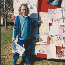 School student with drawings, 2000 Olympics torch relay